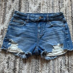 American Eagle distressed denim shorts with lace pockets